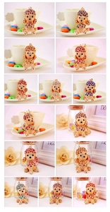 Detailed grid display of 12 colorful rhinestone poodle dog keychain metal pendants