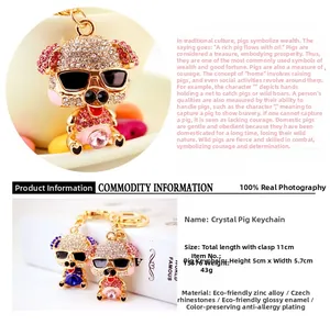 Close-up of a sparkling rhinestone piggy keychain with enamel nose and sunglasses detail