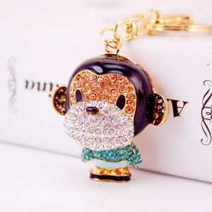 Monkey keychain with purple and blue rhinestones on a gold metal alloy ring