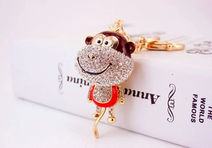 Detail of creative rhinestone monkey keychain with gold alloy finish and lobster clasp