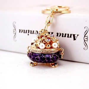 Chinese style crystal incense burner keychain with purple enamel and white pearls