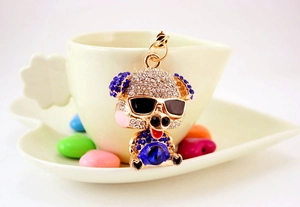 Detailed view of pig keychain featuring shiny rhinestones and a blue gem heart