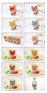 Detail showing various colors of rhinestone-encrusted cartoon fox metal keychains