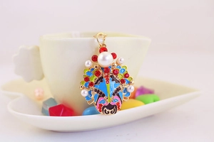 Detailed shot of Chinese Peking Opera mask pendant with colorful enamel and inlaid pearls