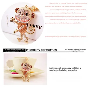 Close-up of golden dancing monkey keychain with sparkling rhinestones and zinc alloy detail