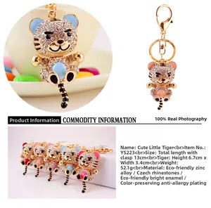 Detail of cartoon tiger keychain with Czech rhinestones and colorful oil drip finish