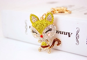 Detailed view of the diamond-studded cartoon fox keychain featuring colorful rhinestones