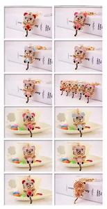 Detailed macro showcase of rhinestone-studded cartoon tiger keychains in various colors