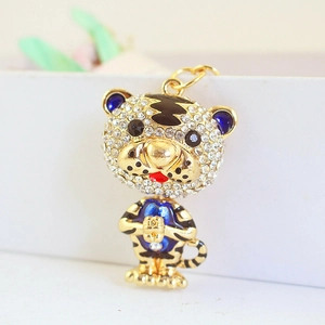 Porte-clés tigre du zodiaque doré avec strass blancs et détails en émail bleu