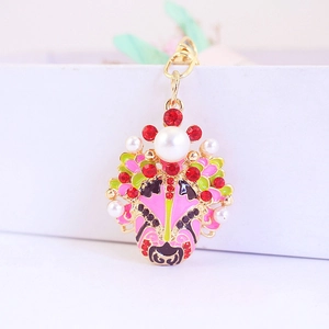 Exquisite pink Peking Opera mask keychain with enamel oil finish and pearl accents