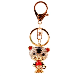 Porte-clés tigre mignon avec strass et détails en émail rouge sur fond blanc pur