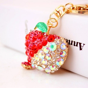 Sparkling apple keychain with red and white rhinestones and gold hardware for women