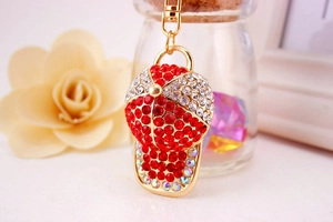 Macro shot of rhinestone baseball cap keychain with colorful crystals and gold lobster clasp