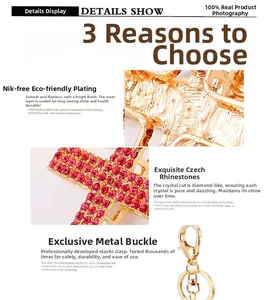 Close-up of gold-plated keychain with red rhinestones and a metal spring clip buckle