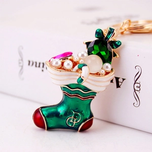 Creative Christmas sock keychain with green enamel, pearls, and sparkling rhinestones