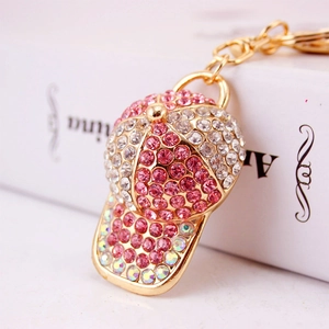 Sparkling rhinestone baseball cap keychain with pink crystals and gold metal finish