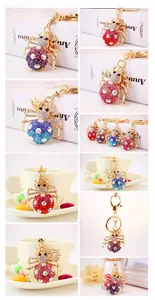 Detail showing multi-colored rhinestone spider keychains with gold lobster clasps