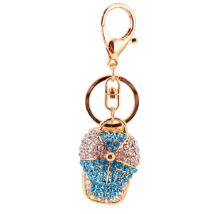 Sparkling rhinestone baseball cap keychain with blue and silver crystals on gold hardware
