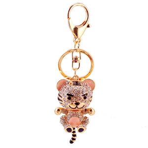 Sparkling rhinestone tiger keychain with gold alloy finish and black enamel details