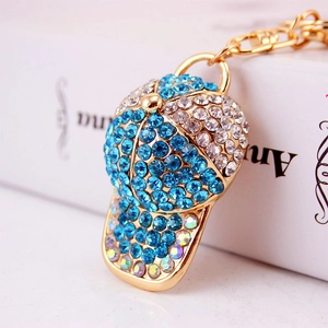 Creative rhinestone baseball cap keychain with blue and white crystals on gold alloy