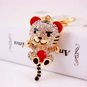 Sparkling crystal encrusted tiger keychain with gold plating and red enamel details