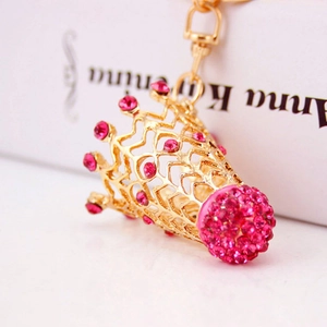 Golden crown badminton keychain with sparkling pink rhinestones and a luxury metal finish