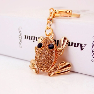 Cute frog keychain pendant in gold-tone metal with amber rhinestones and crystals