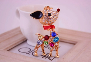 Close-up of colorful crystal deer pendant with gold alloy and sparkling rhinestones