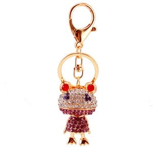 Funkelnder Schlüsselanhänger mit Kristall-Frosch im lila Kleid und Gold-Karabiner