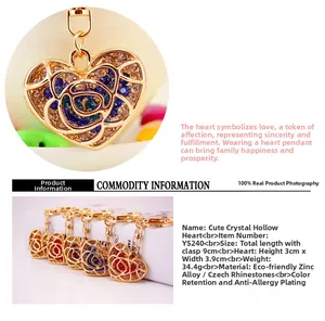 Macro shot of heart shaped keychain with sparkling colorful rhinestones and gold plating