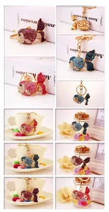 Detailed views of rhinestone goldfish keychains in various colors and designs