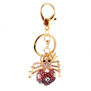 Golden spider keychain with purple rhinestones and colorful crystals for bags