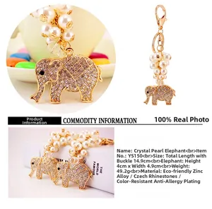 Detailed view of crystal elephant keychain with white pearls and gold alloy lobster clasp