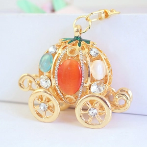 Golden pumpkin carriage keychain with colorful opal stones and sparkling rhinestones