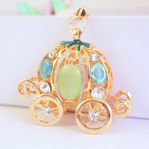 Exquisite gold pumpkin carriage keychain pendant with green cat eye stone and blue crystals