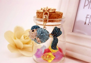 Detailed view of goldfish keychain with sparkling blue rhinestones and gold metal lobster clasp