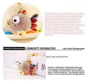 Detail of creative tropical fish keychain with sparkling multi-colored rhinestones and gold plating