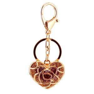 Creative gold heart keychain with hollow rose design and sparkling rhinestones for women