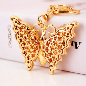 Kreativer Schmetterling Schlüsselanhänger mit Opal und Diamanten in Goldoptik