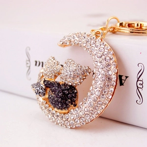 Creative moon and cats keychain with sparkling rhinestones in a gold metal setting