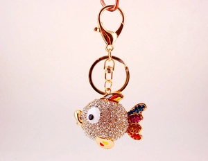 Detail of tropical fish keychain with sparkling rhinestones and colorful enamel fins