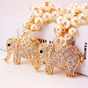 Elegant gold elephant keychain with sparkling rhinestones and white pearl cluster charms