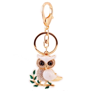 Sparkling owl keychain with white enamel and rhinestones on gold-plated metal link