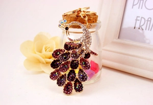 Close-up of colorful rhinestone peacock keychain with detailed crystal inlay craft