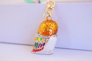 Macro shot of colorful owl keychain pendant with sparkling rhinestones and gold alloy clasp