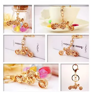 Detailed views of gold motorcycle keychain featuring crystal rhinestones and lobster clasp