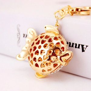 Creative gold fish keychain with heart cutouts and white crystals for women bags