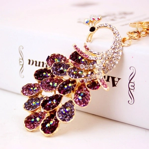 Sparkly peacock keychain with purple crystals and gold alloy plating for women handbag