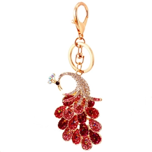 Colorful peacock keychain with red and pink crystals on a gold-plated metal base