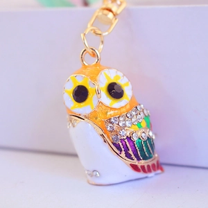 Colorful owl keychain with sparkling rhinestones and vibrant enamel on a gold metal base